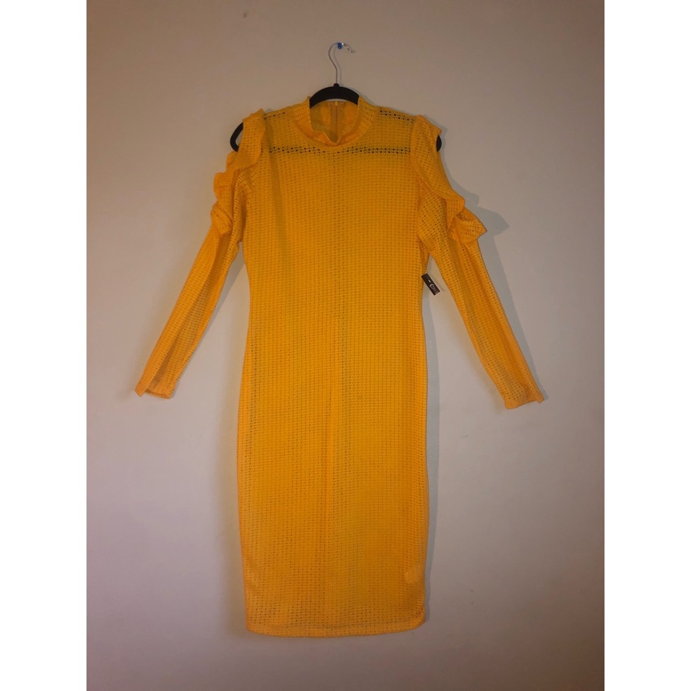 Yellow long sleeve dress. Sleeve shouldercut outs.
